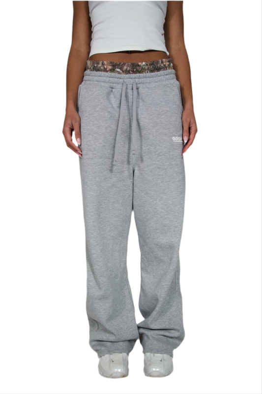 Light grey sweatpants made from soft fabric, ideal for casual wear and comfort.